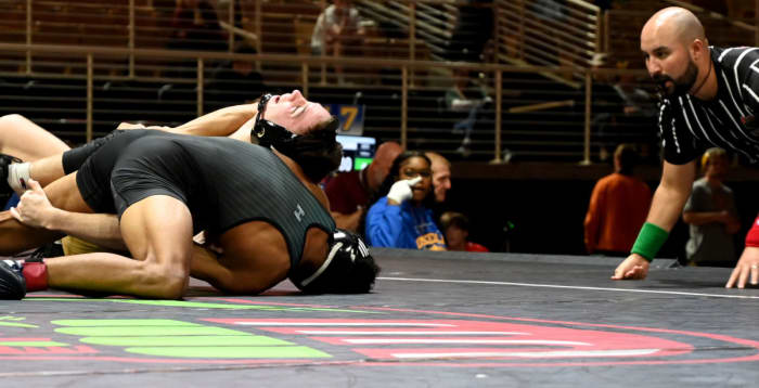 Jaydon Robinson of Winter Springs wins the 144-pound title match, 8-3, against Cavarius Liddle of Buchholz during the title match on Saturday at the Knockout Christmas Classic at Silver Spurs Arena in Kissimmee.